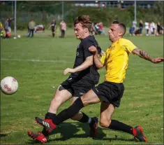  ??  ?? Bobby Greenan of Newtown United is tracked by Danny Byrne of St Peter’s.