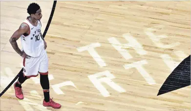  ?? CANADIAN PRESS FILE PHOTO ?? Raptors guard DeMar DeRozan walks off the court after taking a loss in overtime in second-round National Basketball Associatio­n playoff action against the Cleveland Cavaliers in Toronto on May 1.
