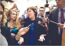  ?? THE ASSOCIATED PRESS ?? Sen. Susan Collins, R-Maine, is surrounded by reporters on Capitol Hill in Washington Thursday after a revised version of the Republican health care bill was announced by Senate Majority Leader Mitch McConnell.