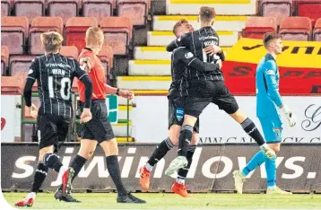  ??  ?? Man of the Match Kevin Nesbit celebrates scoring his side’s fith of the afternoon