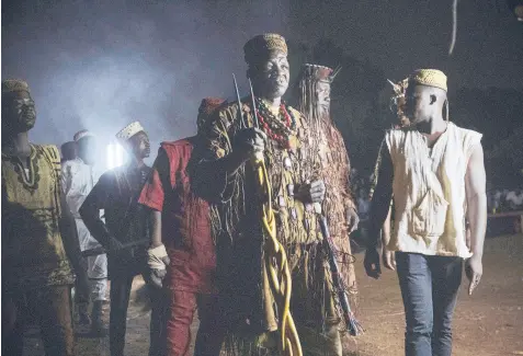  ??  ?? Dozos, ancient hunters drawn into the fight against Islamic extremists, believe people can rely on powers from their ancestors. They participat­e in a celebratio­n of their culture in March in Bobo-Dioulasso, Burkina Faso.