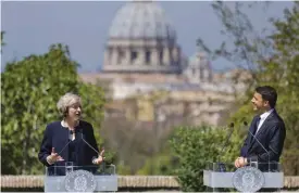  ??  ?? ROME: Italian Premier Matteo Renzi (right) listens to British Prime Minister Theresa May during a joint press conference at the end of their meeting in Rome on Wednesday, July 27, 2016. In the background Rome’s landmark St Peter’s Basilica at the...