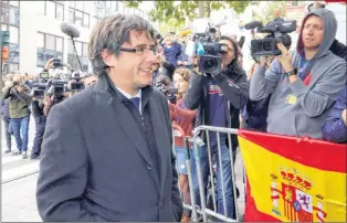  ?? AP PHOTO ?? Ex-catalonian President Carles Puigdemont arrives for a press conference in Brussels, Tuesday. A Spanish judge has issued an internatio­nal arrest warrant for Puigdemont and several of his aides.