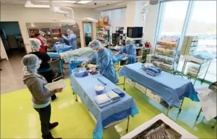  ?? JONATHAN TRESSLER — THE NEWS-HERALD ?? Students work in the Perioperat­ive Education Laboratory inside the new Health Technologi­es addition at Lakeland Community College’s main campus in Kirtland in this Feb. 13 photo.