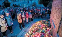  ?? ?? The villa used for the Wannsee Conference; Right, people mourn near the entrance to a synagogue in Halle, Germany, after a 2019 attack that left two people outside the building dead.