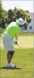  ?? STAFF PHOTO BY MICHAEL REID ?? Jim Hicks of White Plains chips onto the green on his way to a win in the Senior Division’s Flight 1 Sunday at the Southern Maryland Amateur Golf Tournament at Breton Bay Golf & Country Club in Leonardtow­n.