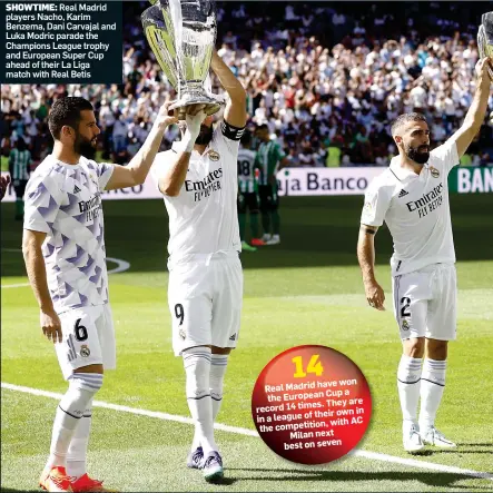  ?? ?? SHOWTIME: Real Madrid players Nacho, Karim Benzema, Dani Carvajal and Luka Modric parade the Champions League trophy and European Super Cup ahead of their La Liga match with Real Betis