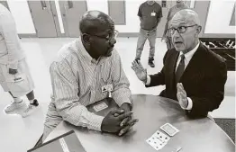  ?? Steve Gonzales / Staff file photo ?? Ronald Mitchell, left, talks with state Sen. John Whitmire, D-Houston, in 2015 at the Texas Civil Commitment Office’s lone facility, in Littlefiel­d. Whitmire led an effort to overhaul TCCO.