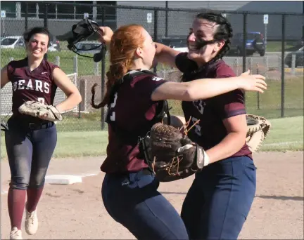  ?? PHOTOS BY MATTHEW MOWERY — MEDIANEWS GROUP ?? Berkley catcher Ella Schneider (center) and pitcher Brooke Bommarito (right) embrace after the final out of a 10-3 win over Ferndale in the Division 1district championsh­ip game at Royal Oak High School on Friday.