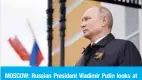  ?? — AFP ?? MOSCOW: Russian President Vladimir Putin looks at military aircraft flying over the Kremlin and Red Square on Saturday to mark the 75th anniversar­y of the victory over Nazi Germany in World War Two.