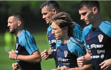  ?? — AFP ?? Move forward: (From left) mateo Kovacic, dejan Lovren, Luka modric and goalkeeper dominik Livakovic at a training session.