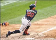  ?? Adam Hunger / Associated Press ?? The Braves’ William Contreras hits an RBI double against the Mets during the 10th inning on Saturday.