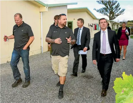  ?? PHOTO: DEREK FLYNN/FAIRFAX NZ ?? Touring seasonal worker accommodat­ion are, from left, Hortus operations manager Rob Slatter, Hortus owner Aaron Jay, Kaikoura MP Stuart Smith and Immigratio­n Minister Michael Woodhouse.