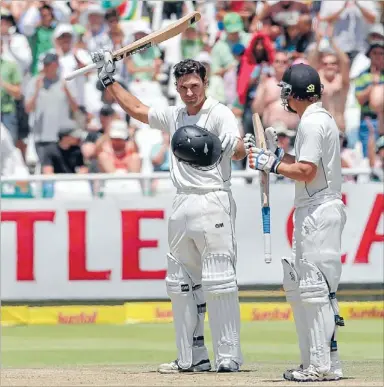  ?? Photo: GETTY
IMAGES ?? Our hero: Dean Brownlie, left, celebrates his century for New Zealand, one of very few highlights for the Black Caps in the first test that finished abruptly overnight in Cape Town.