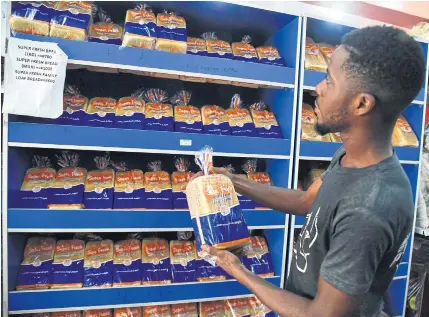  ?? ?? A supermarke­t in Lagos, Nigeria, displays prices for bread. Russia and Ukraine are major suppliers of wheat to Africa.