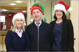  ??  ?? Vera, Andy and Ciara have a warm festive welcome for customers at Mallow Credit Union.