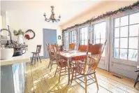  ??  ?? The breakfast room has a wood floor, a double French door walkout and many windows overlookin­g the backyard.