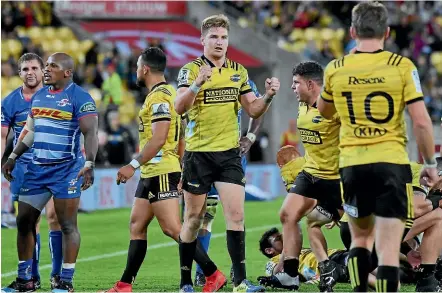  ?? PHOTOSPORT ?? Jordie Barrett, centre, celebrates another narrow escape for the Hurricanes, this one against the Stormers.