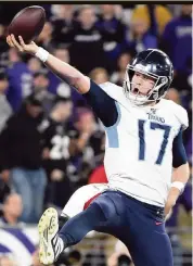  ?? WILL NEWTON Getty Images ?? Titans quarterbac­k Ryan Tannehill celebrates after rushing for a touchdown in the third quarter of Tennessee’s win against the Ravens on Saturday night.