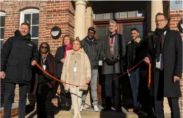  ?? Pictures: Jake Clothier ?? The mayor of Reading, Cllr Tony Page, is joined by propsectiv­e residents, among others, at the unveiling of new homes built on the site of the former Arthur Hill swimming pool