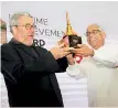  ??  ?? Philippe Starck receiving his Lifetime Achievemen­t Award from Hon. Eran Wickramara­tne - State Minister of Finance.