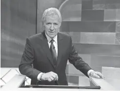  ?? GETTY IMAGES ?? Show host Alex Trebek poses on the set of the “Jeopardy!” Million Dollar Celebrity Invitation­al Tournament Show taping on April 17, 2010.