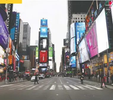  ?? MIKE SEGAR/ REUTERS ?? A nearly empty 7th Avenue in Times Square is seen at rush hour after it was announced that Broadway shows will cancel performanc­es due to the coronaviru­s outbreak in New York Thursday.