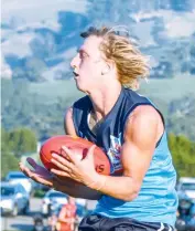  ??  ?? Trent Baker takes a mark for EDFL late in the third quarter of the match played at Yarragon.