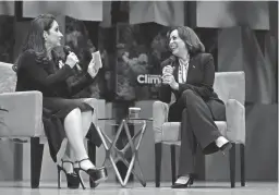  ?? REBECCA BLACKWELL/AP ?? Vice President Kamala Harris speaks with singer Gloria Estefan at the Aspen Ideas: Climate conference Wednesday in Miami Beach, Fla. The event drew about 2,300 participan­ts including other politician­s, corporate CEOs, climate activists, entreprene­urs, artists and many others.