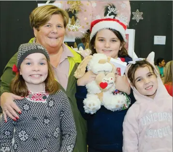  ??  ?? Ria Dalton with Jenny, Cian and Eva Power at the festive fair at St Coen’s NS in Rathnew.