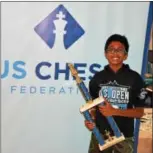  ?? SUBMITTED PHOTO ?? Karthik Murugan, a student at Marsh Creek Sixth Grade Center in the Downingtow­n Area School District, holds the trophy he won at the National Elementary Championsh­ips in Norfolk, Va. on July 30.