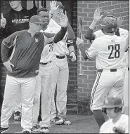  ?? Arkansas Democrat-Gazette/THOMAS METTHE ?? Coach Chris Curry (left) and the University of Arkansas at Little Rock hit the ground running to start the season, with series against Creighton and Oklahoma State in the first week, as well as games against Ole Miss, Mississipp­i State, Oral Roberts and Arkansas.
