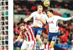  ??  ?? Tottenham Hotspur’s English striker Harry Kane (C) leaps to head home their third goal during the English Premier League football match between Tottenham Hotspur and Stoke City at Wembley Stadium in London, on December 9, 2017. - AFP photo