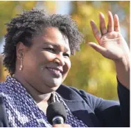  ?? BRYNN ANDERSON/AP ?? Politician Stacey Abrams speaks to supporters of Democratic presidenti­al candidate Joe Biden as they wait for former President Barack Obama to arrive and speak at a rally on Nov. 2 at Turner Field in Atlanta.