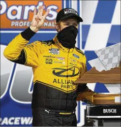  ?? STEVE HELBER / ASSOCIATED PRESS ?? Brad Keselowski shows off his trophy in Victory Lane in Richmond, Va., after Saturday night’s NASCAR Cup Series playoff race. Keselowski led 192 laps in the series’ second playoff race.