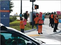  ?? SHMUEL THALER — SANTA CRUZ SENTINEL FILE ?? Nurses at Watsonvill­e Community Hospital line Airport Boulevard outside the hospital in December to protest possible changes to the nurse-patient ratio, which they say will necessaril­y reduce the level of care.