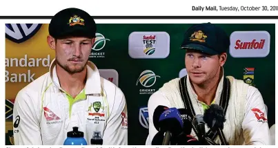  ?? AFP ?? Shameful: Aussies Bancroft and Smith face the media after the ball-tampering scandal