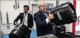  ?? ?? TROUBLE BREWING?: Boris Johnson and Rishi Sunak on a visit to a beer maker last year. MPS say poor local election results could reignite a rebellion