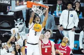  ?? Ross D. Franklin The Associated Press ?? Guard Stephon Castle led Uconn with 21 points on 7-of-13 shooting Saturday in the national semifinals against Alabama.