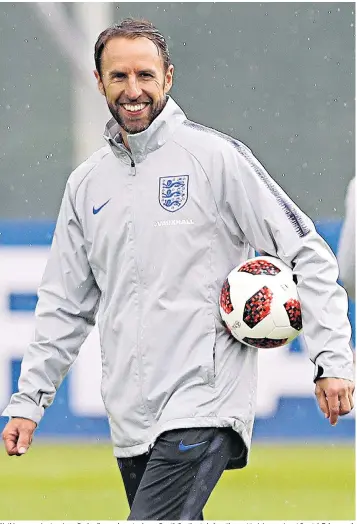  ??  ?? Nothing was going to rain on England’s parade yesterday as Gareth Southgate led a rather wet training session at Spartak Zelenogors­k Stadium in Russia, the day after his team’s World Cup penalty shoot-out victory against Colombia