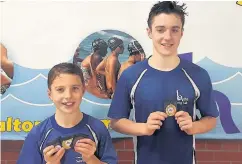 ??  ?? Ben and Sam Clayton with their medals won in Wales.