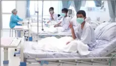  ?? ThaIland GoVernmenT SPokeSman Bureau VIa aP ?? In this image made from video, released by the Thailand Government Spokesman Bureau, three of the 12 boys are seen recovering in their hospital beds after being rescued along with their coach from a flooded cave in Mae Sai, Chiang Rai province,...