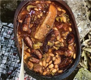  ?? ?? Campfire pork and beans from Outside by Gill Meller.