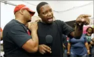  ?? THE ASSOCIATED PRESS ?? Nissan employee Morris Mock, left, consoles colleague Antonio Hoover as he expresses his disappoint­ment at losing their bid to form a union at the Nissan vehicle assembly plant in Canton, Miss. on Friday.