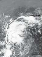  ?? AP ?? This satellite image provided by NOAA shows Tropical Storm Nicholas in the Gulf of Mexico on Sunday.