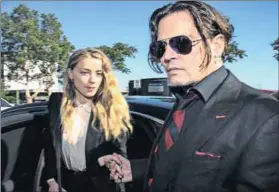  ?? Photo: Patrick Hamilton/AFP ?? Whiplash: Actor Johnny Depp and his wife Amber Heard as they arrived at a court in the Gold Coast. On May 25, Heard filed for divorce citing irreconcil­able difference­s.