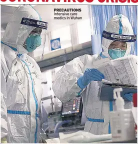  ??  ?? PRECAUTION­S Intensive care medics in Wuhan