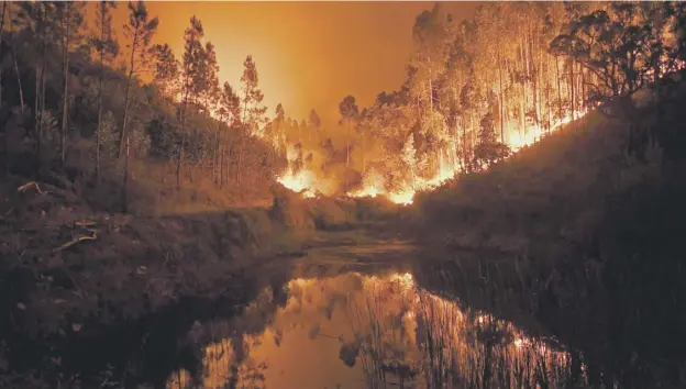  ?? PICTURE: GETTY IMAGES ?? 0 A lightning strike is believed to have sparked the blaze in which at least 62 people were killed in the Pedrogao Grande area