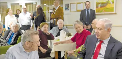  ?? (Amos Ben Gershom/GPO) ?? PRIME MINISTER Benjamin Netanyahu meets with residents of the Siegfried Moses Senior Residence in Jerusalem on Monday.