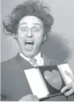  ?? PA VIA AP | ?? Ken Dodd poses with his award for Show Business Personalit­y of the Year on March 8, 1966.